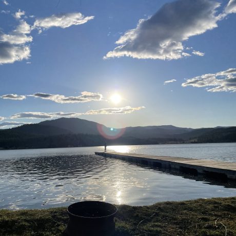 Lake man fishing in the distance image