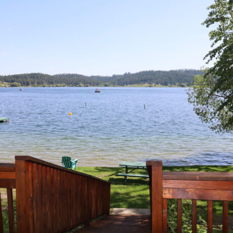 North Winona Cabins overlooking a calm, scenic lake at sunset